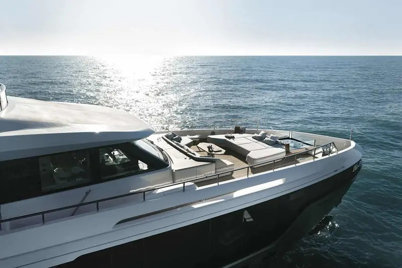 Bow view under way, showing the semi-walkaround deck running forward to a foredeck lounge and jacuzzi, the feature independent judges singled out when the Grande 36M won Best of Show at Fort Lauderdale.