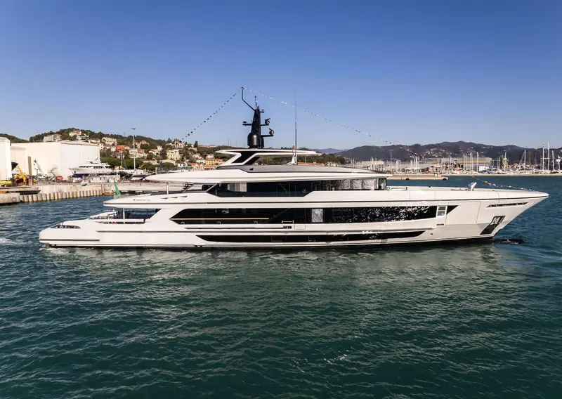 Ark of Fate, the first Baglietto T52 hull and the debut of the line's diesel-electric hybrid propulsion, dressed with signal flags at her 2023 launch in La Spezia.