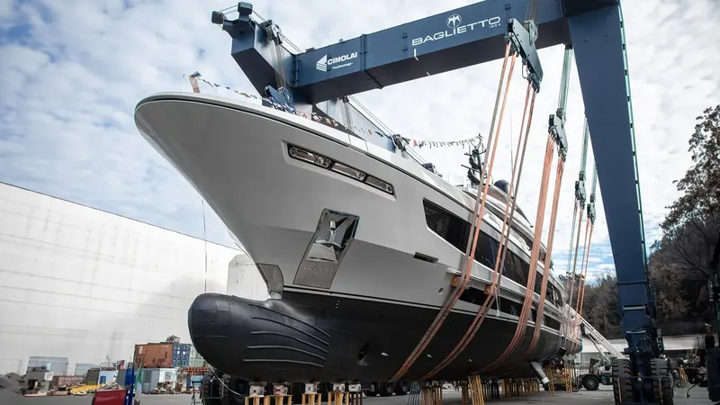 Infinity, the second Baglietto T52 hull, suspended in her launch cradle at the Baglietto yard under the Cimolai travel crane.