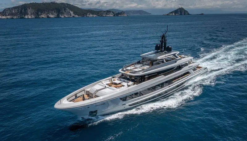Ark of Fate under way off the Ligurian coast, the raked bow and sensor mast that define the T-line's modern profile visible against the islands of the Golfo dei Poeti.