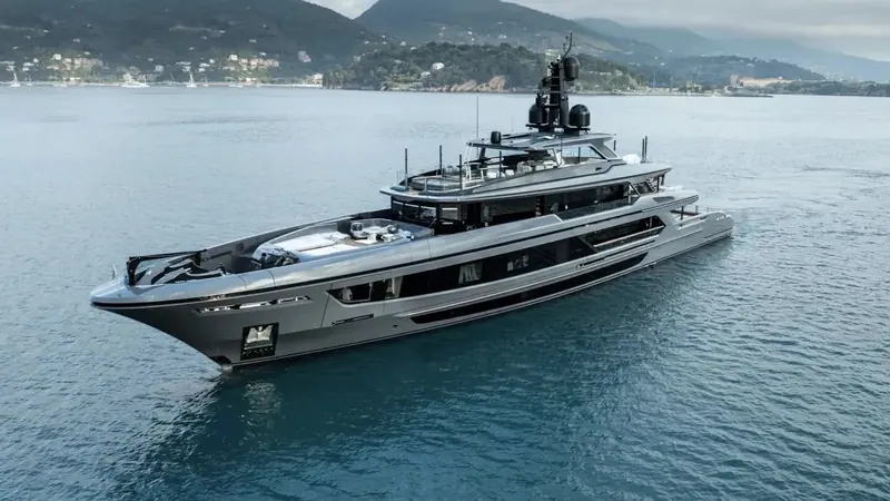 Akula, the third Baglietto T52 hull, under way off Portofino with the Golfo del Tigullio behind her.