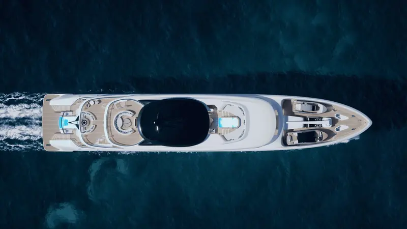 A straight-down aerial shows the full deck plan at once: the black glazed wheelhouse roof forward, twin tenders garaged either side of the foredeck, and the drop-down bathing platform aft.