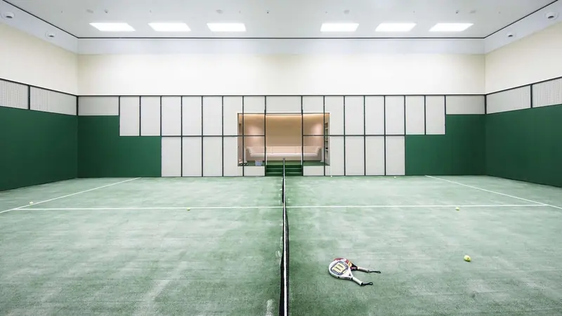 The full-size indoor tennis and padel court below decks, convertible to other uses and rare even among yachts of this size.