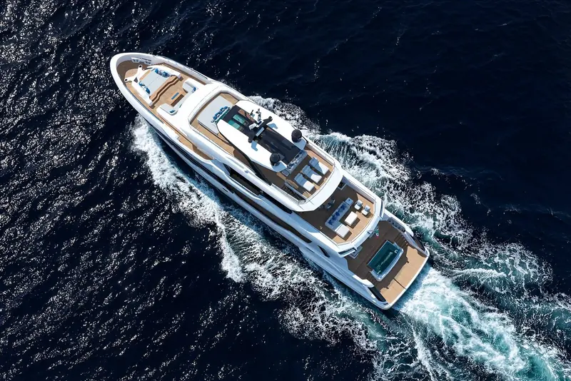 An aerial running shot showing the full deck plan: a foredeck lounge forward of the bridge, sundeck amidships and the aft jacuzzi terrace, three separate outdoor spaces on a 40-metre hull.