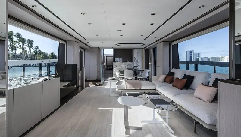 The alternative Contemporaneo scheme sets a paler oak against Miami's palm-lined waterfront, one of two interior moods Ferretti offers on the same layout.