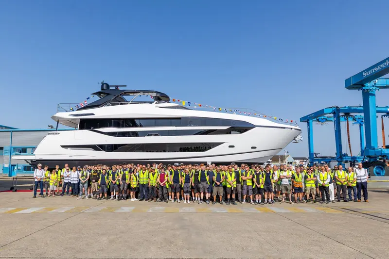 Sunseeker's Poole workforce, several hundred strong, gathers in front of the finished hull for the traditional launch-day photograph.