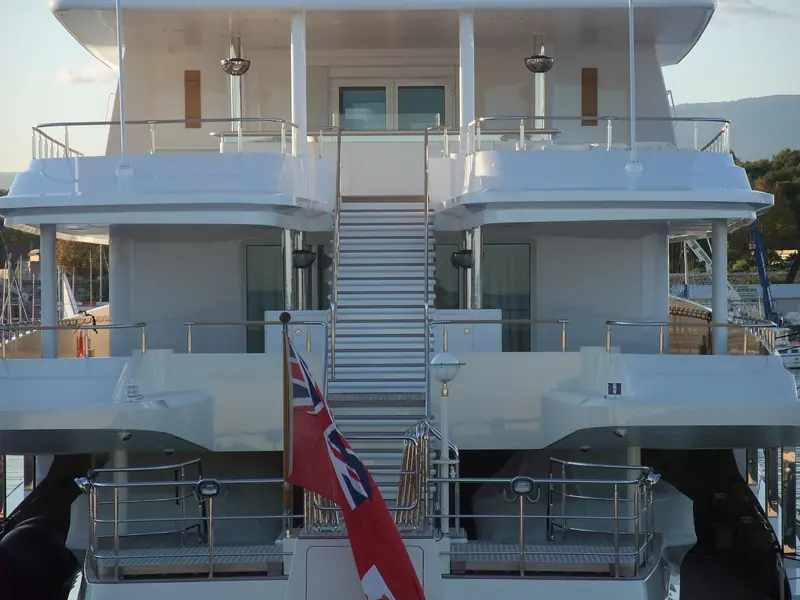 Coral Island's stern and Hamilton registry, photographed in Antibes in 2009, before the 2022 hull-to-helm rebuild that produced today's Coral Ocean.