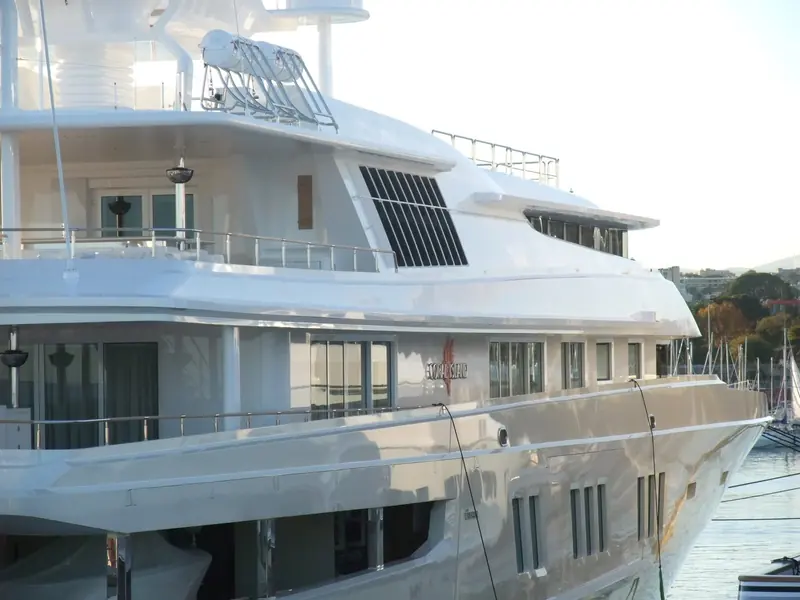 A broadside view of the 73-metre hull at Antibes, the same profile Ahoy Club has since rebuilt twice.