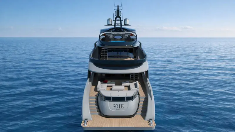 Soie seen head-on in the concept renderings, her full beam and glazing visible before any hull has been cut.