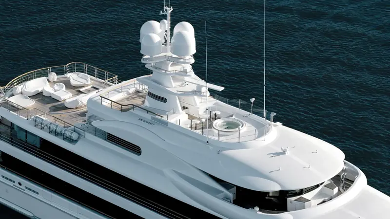 An aerial view of Synthesis's sundeck and jacuzzi taken during sea trials, her IMO number stencilled below the rail.