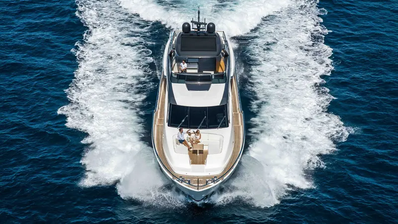 Running at speed from the bow, guests on the flybridge and the helm station open to the sky.