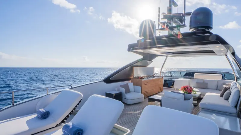 The flybridge, with a wet bar, forward sunpads and an L-shaped seating group aft.