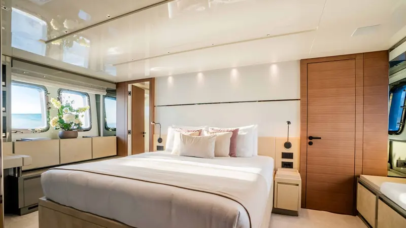 The full-beam owner's suite, with windows running the width of the hull on both sides.
