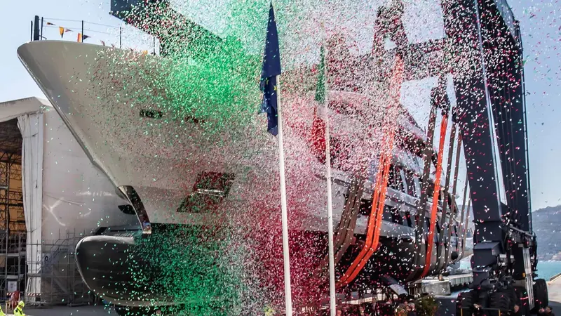 The bow at the launch ceremony. The flared forefoot and the recessed anchor pocket are Francesco Paszkowski Design's, drawn to make the topsides read lighter than a 1,100 GT hull normally does.