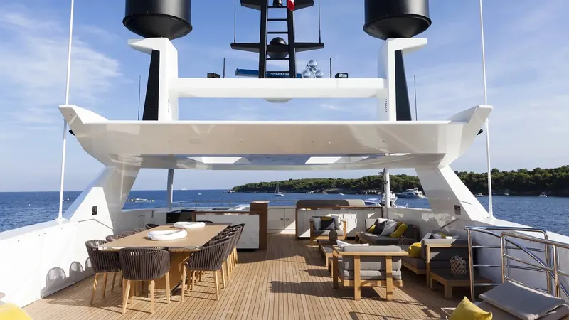 Mr T's aft deck, one of several social spaces the 495 GT displacement yacht offers across her exterior decks.