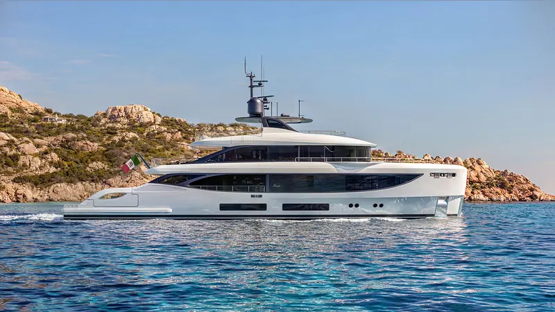 The Oasis 36M running past the Maddalena islands, her hull stretched to 35.6 metres on a 7.8 metre beam.