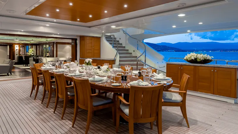 Aft deck dining, one of the outdoor entertaining areas alongside the yacht's beach club.