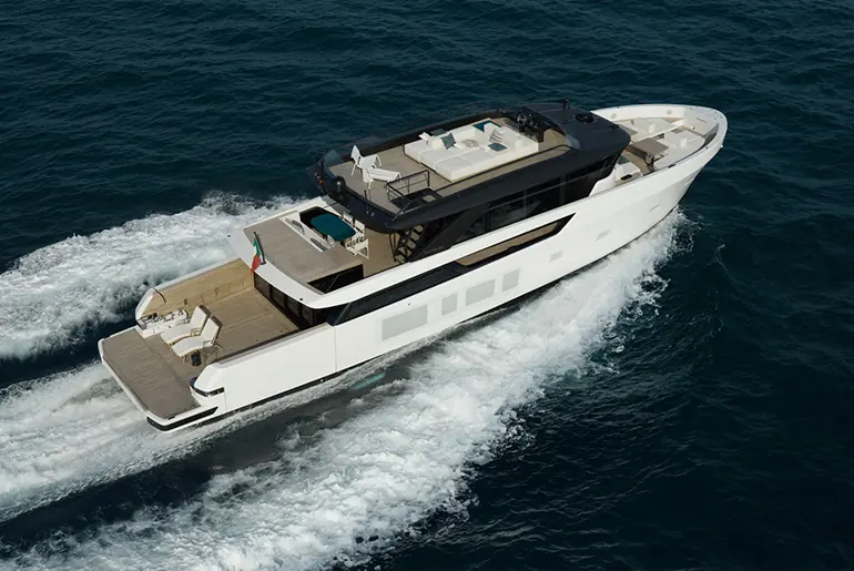 The BGX83's low-slung profile and dark hardtop carry over Bluegame's smaller BGX models, scaled up to the yard's largest hull yet.