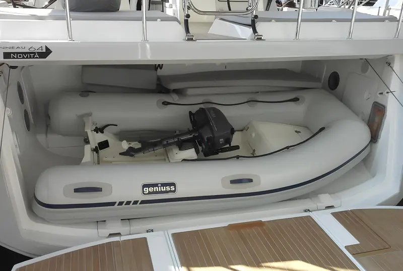 The payoff: a Geniuss tender and its outboard stowed inside a yacht's own stern garage, the lower unit no longer dictating how tall or deep the opening has to be.
