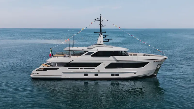 The RJ line's signature profile - recessed windows, a flared bow, a sinuous stern - carried down to a hull two size classes smaller than Paszkowski had drawn it before.