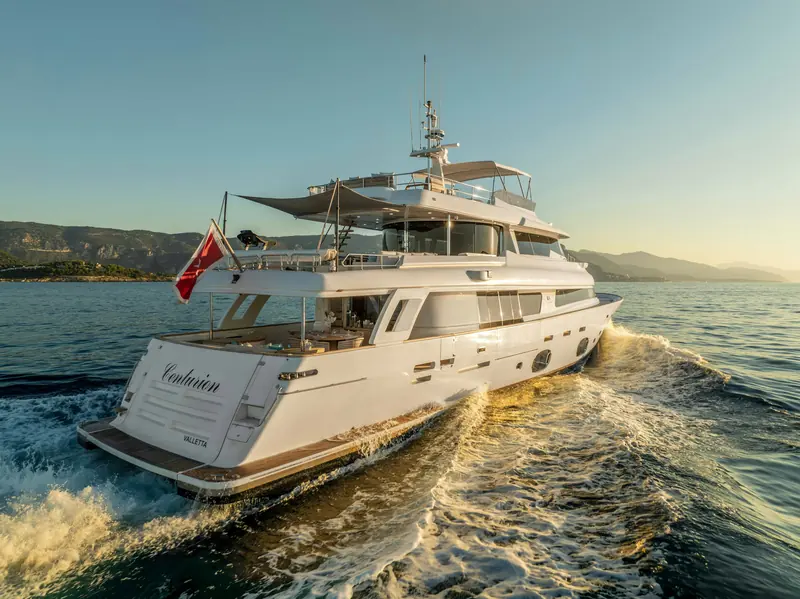 Centurion's flared bow and dark hull glazing, the Zuccon-drawn lines of the Navetta 33 Crescendo layout.