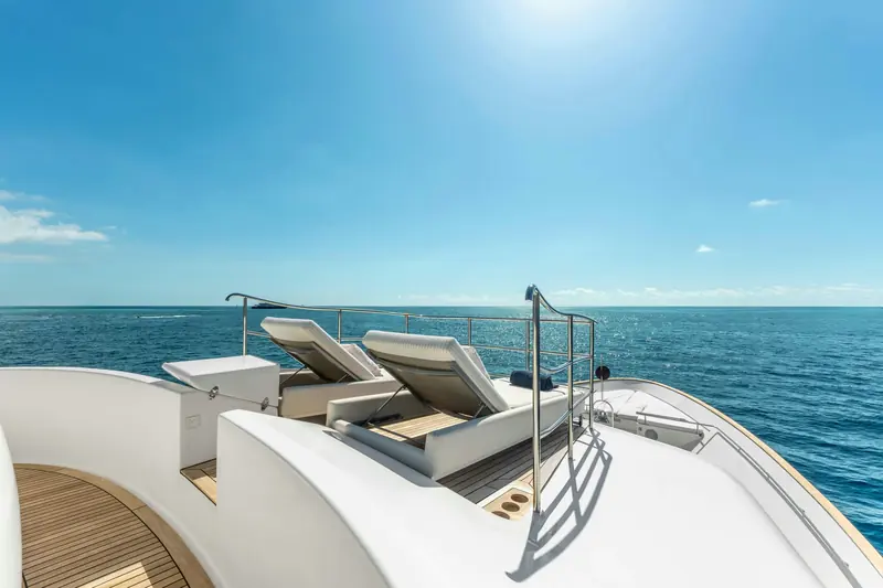 Foredeck sunpads facing forward, part of the 184 GT layout built for 11 guests across five cabins.