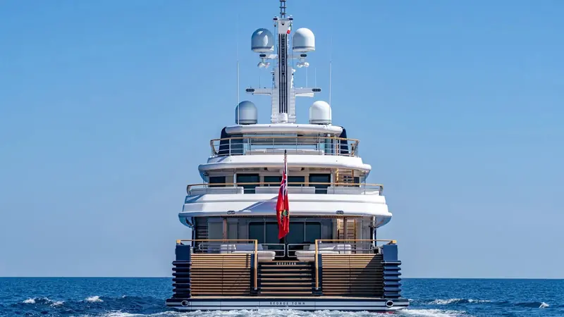 The stern carries the name Cerulean and the home port George Town, Cayman Islands, with a folding beach-club platform built into the transom.
