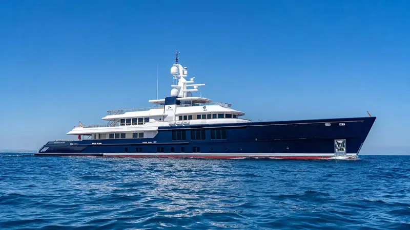 Cerulean's profile shows the navy hull and single red boot stripe CRN has used across its full-custom range.