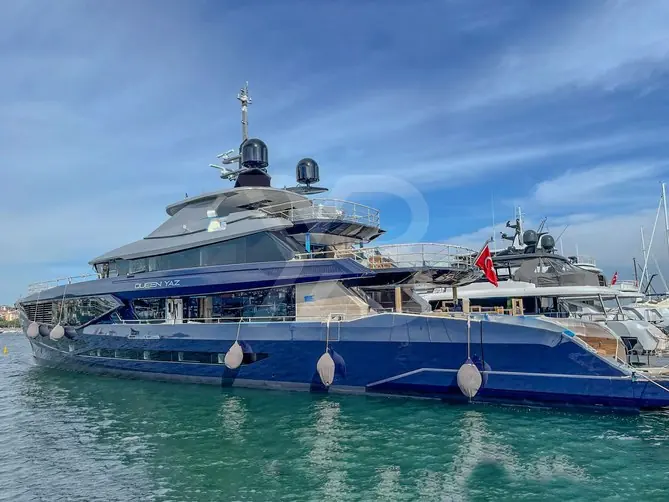 Queen Yaz alongside other yachts under the Turkish flag. She sleeps 10 guests in five cabins - one owner's suite and four guest cabins.