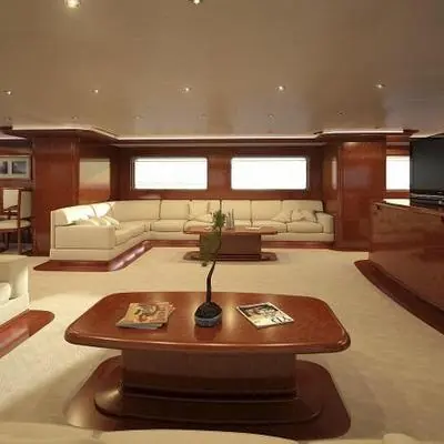 A lower lounge area with an L-shaped sofa, one of several social spaces across her six-cabin layout.