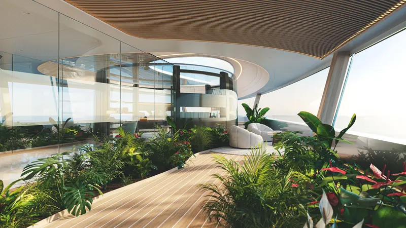 The circular, glass-enclosed foredeck library opening onto a private garden.