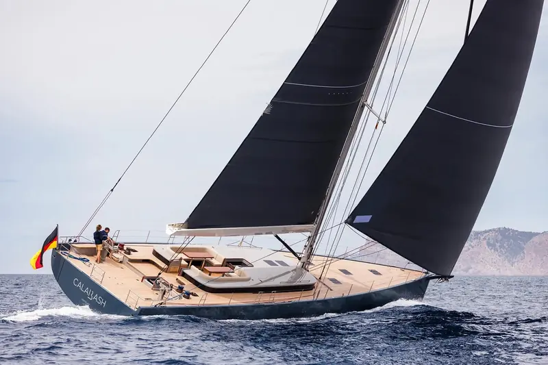 Calabash, an earlier YYachts Y8, under sail off Mallorca. Fitzrovia is the same series' first hybrid-powered hull, delivered August 2026.