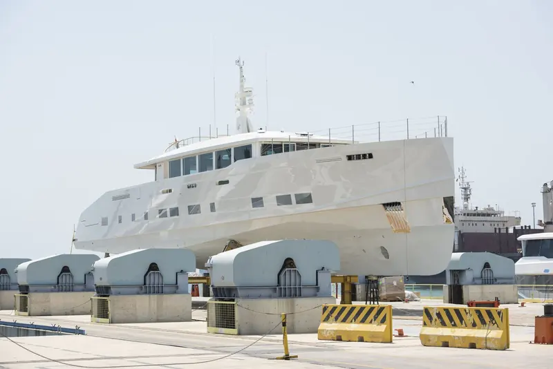 On the hardstand before she went in, standing on the yard's support cradles. Hull and superstructure are both aluminium, which is Alia's core competence and the reason a 45 metre of this shape can reach 23 knots.