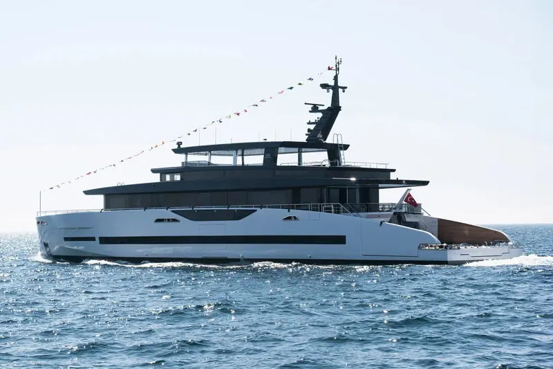 The first GX42, Merinos, runs under launch flags off Istanbul, flying the Turkish flag from SES Yachts.