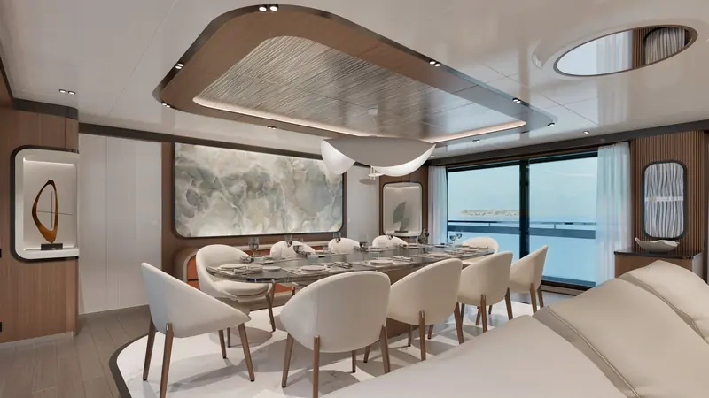 One of the GX42's guest cabins, with a corner sofa and full-height window onto the sea.