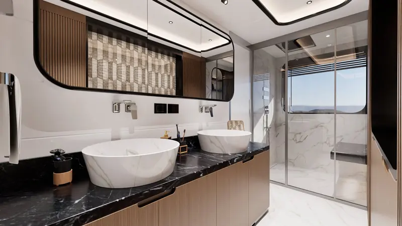 A twin-vanity en-suite bathroom aboard the GX42, in dark marble and walnut.