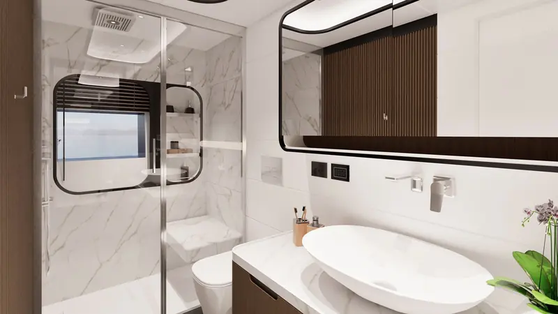 A second en-suite aboard the GX42, with a glass shower stall and marble surfaces.