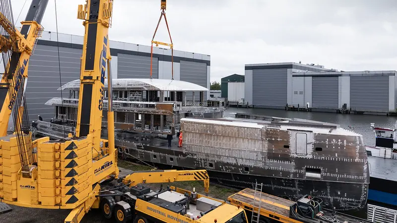 The superstructure going on. Heesen builds hull and superstructure separately and joins them, and this is the lift that fixed the four deck layout, with the bridge one level higher than the yard has ever put it.