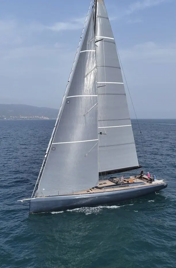 Her full profile shows the dark hull and telescopic keel housing; displacement is a light 37.6 tonnes for a 24-metre carbon build.