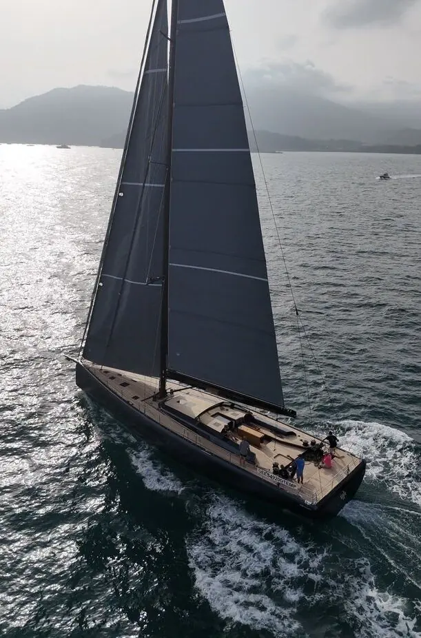 Underway in low light, the yacht carries Felci Yacht Design's full sail plan on a single carbon mast.