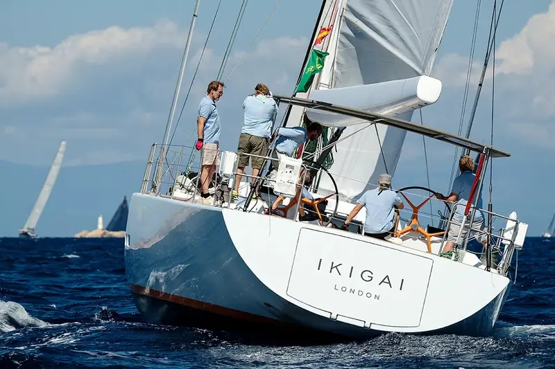 Ikigai's transom, lettered London for her registered hailing port, crewed hard on a race course - the same 25.13m sloop now carrying a EUR 250,000 auction starting bid against a EUR 1,195,000 brokerage asking price.