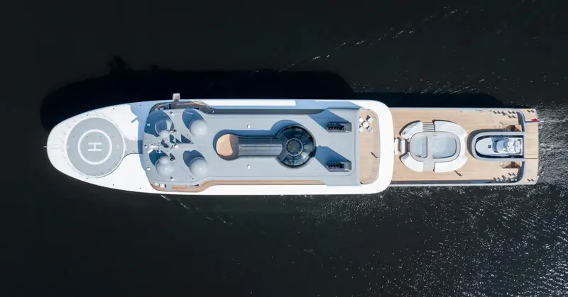 The foredeck in close-up from directly above: helipad, radar mast, and a private pool tucked beside the mast structure - the deck plan of a yacht built to be looked down on as often as up at.