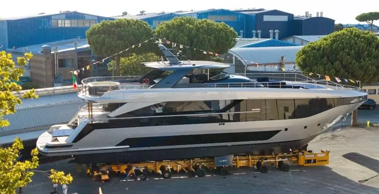 Broadside on the lift, showing the sheer line Quartostile drew for the M|30: a slender forward superstructure and full-height glass over three decks.