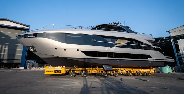 Stern quarter view showing the enlarged beach club deck aft, reworked from the outgoing Maiora 30 into what the yard calls an al fresco veranda.