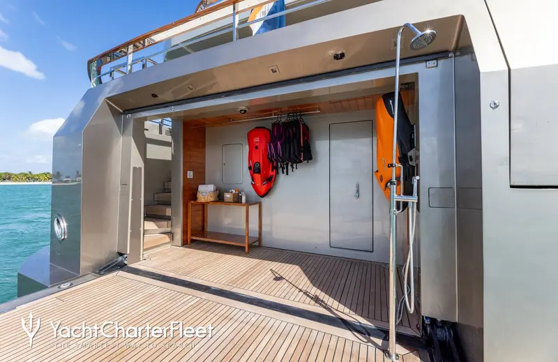 The beach club and water-toy garage, with seabobs and life jackets ready to launch - part of the inventory built for charter weeks in the Mediterranean and Caribbean.