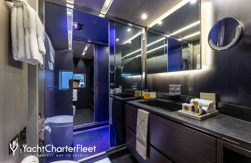 The master bathroom, with 'Maverick' monogrammed on the guest towels - a detail from her working life as a charter yacht, not yard marketing.