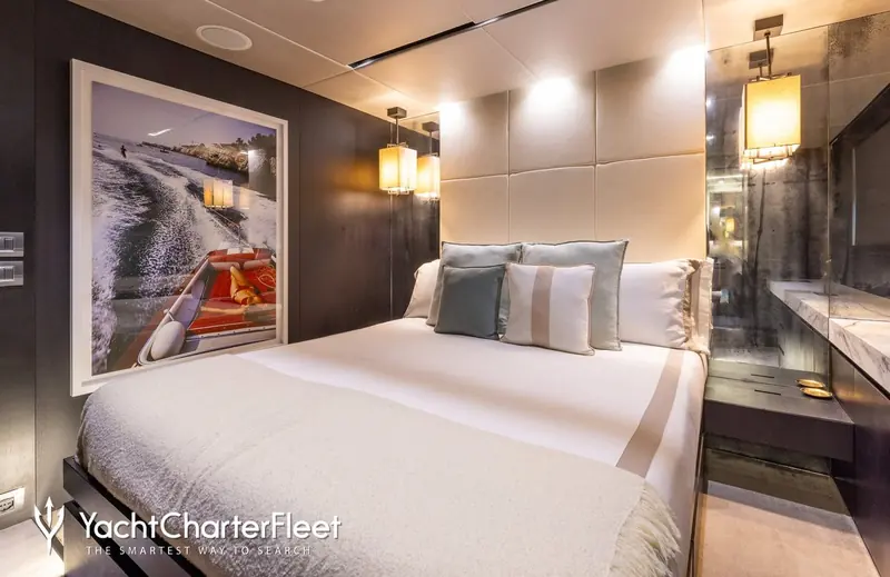 One of the five guest cabins, hung with a framed photograph from her water-skiing days - part of the toy inventory that includes wakeboards, seabobs and paddleboards.