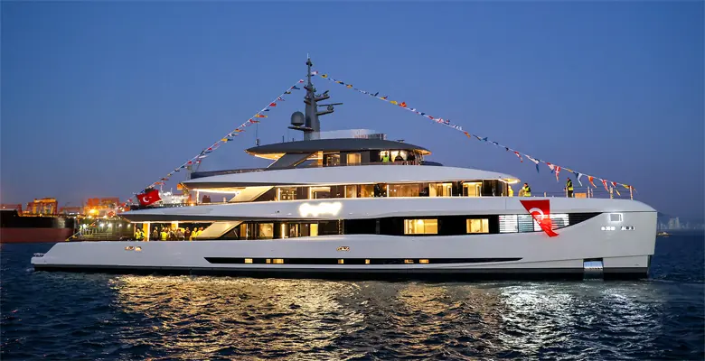 Approaching her berth after launch - the low, three-deck profile Van Oossanen and VYD Studio drew for a boat that has to cross oceans, not just harbours.