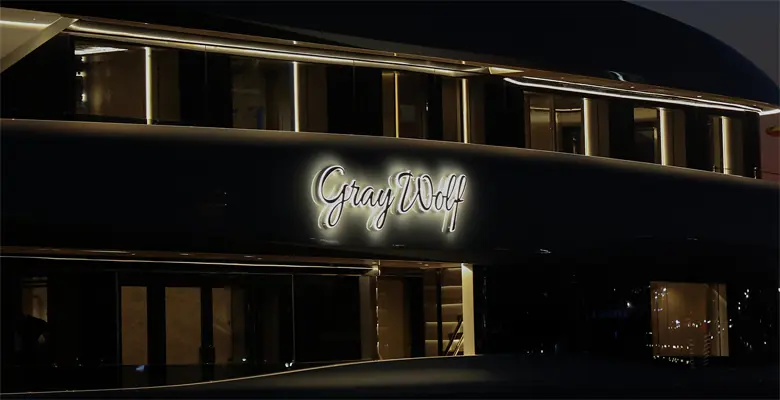 Her name lit in script on the hull the night she launched, before the sea trials that lead to a summer 2026 handover.