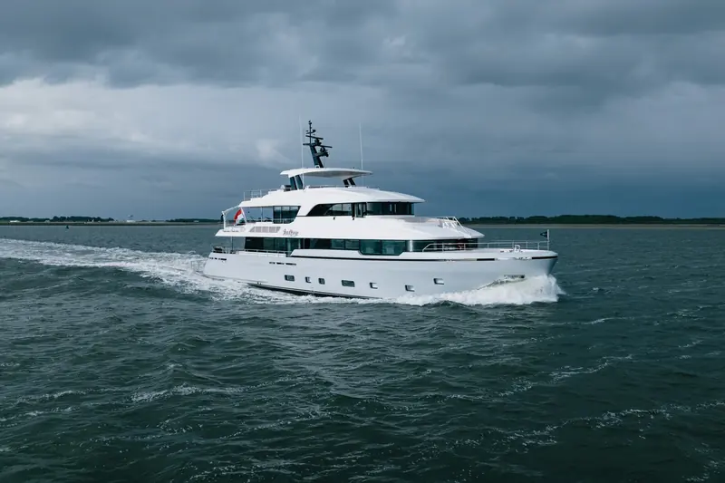 Lollipop on an earlier trial run under grey skies, cutting a hard wake at speed.